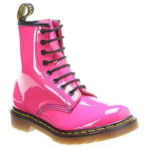 A shiny pink patent leather boot with black laces