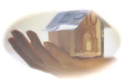 An open hand gently holding a small house