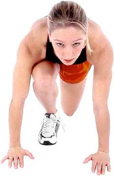 A runner crouched in a starting position